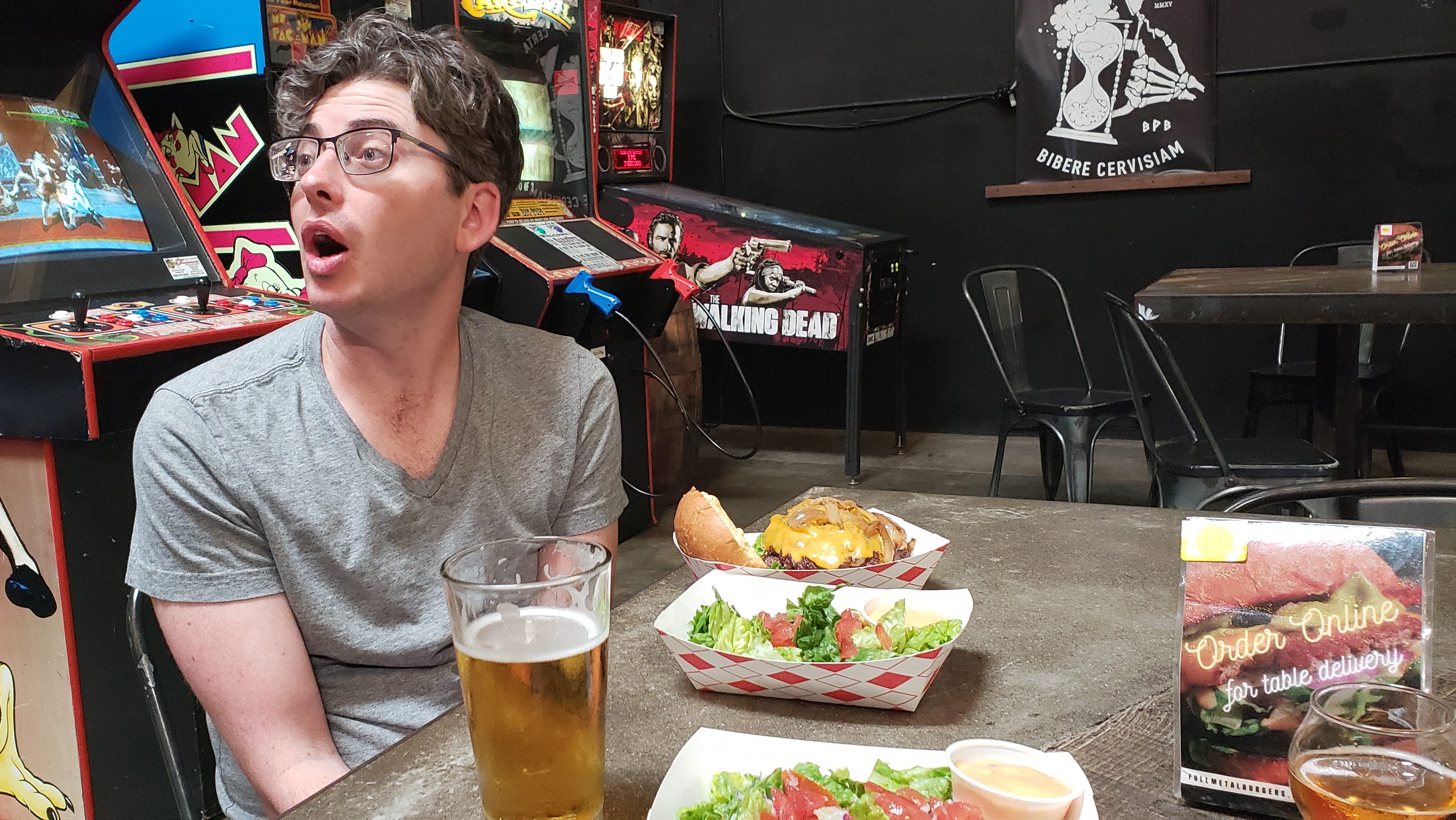 A funny pic of Matthew with his mouth open looking at the beer menu before eating his burger. This was before I noticed the camera.